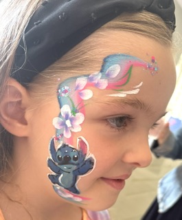 Girl with Stitch face paint in Codsall